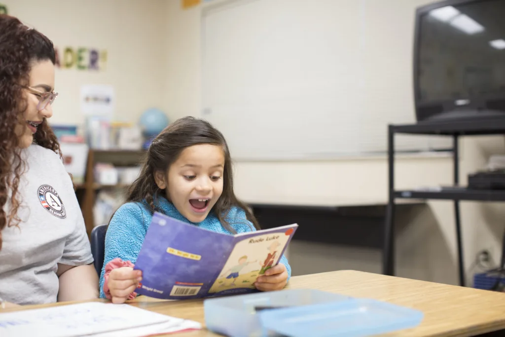 a student-tutor pair during a literacy lesson