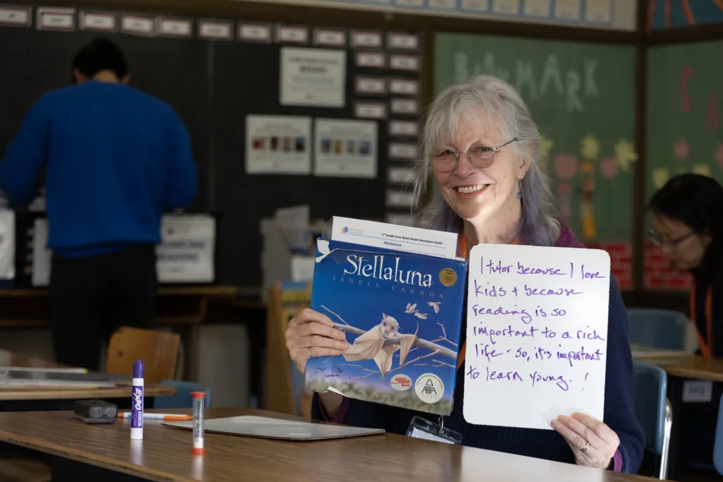volunteer showing why she likes to tutor