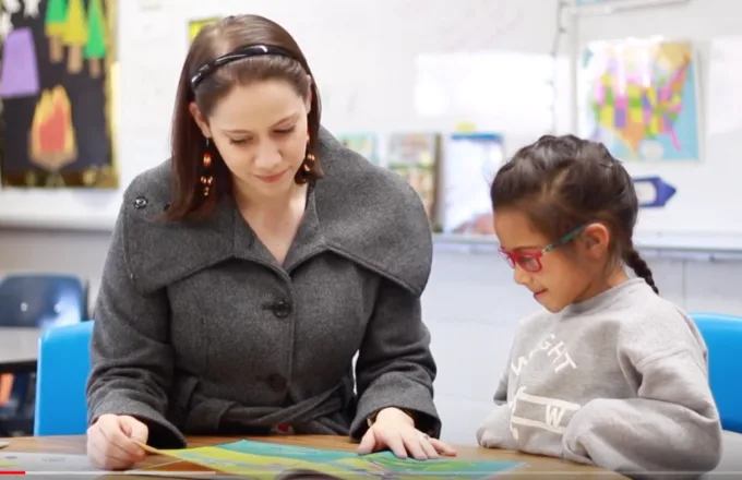 a student-tutor pair during a literacy lesson