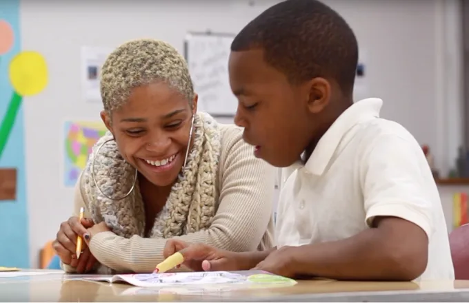 a student-tutor pair during a literacy lesson