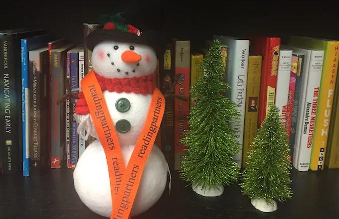 snowman wearing reading partners lanyard