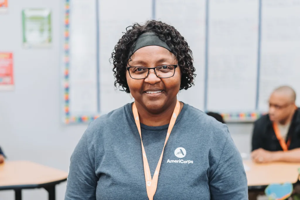an americorps member smiling at the camera