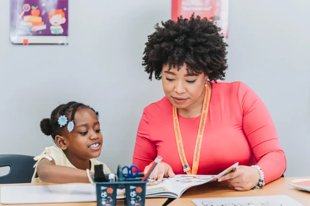 a student and tutor working together on boosting the student's literacy skills