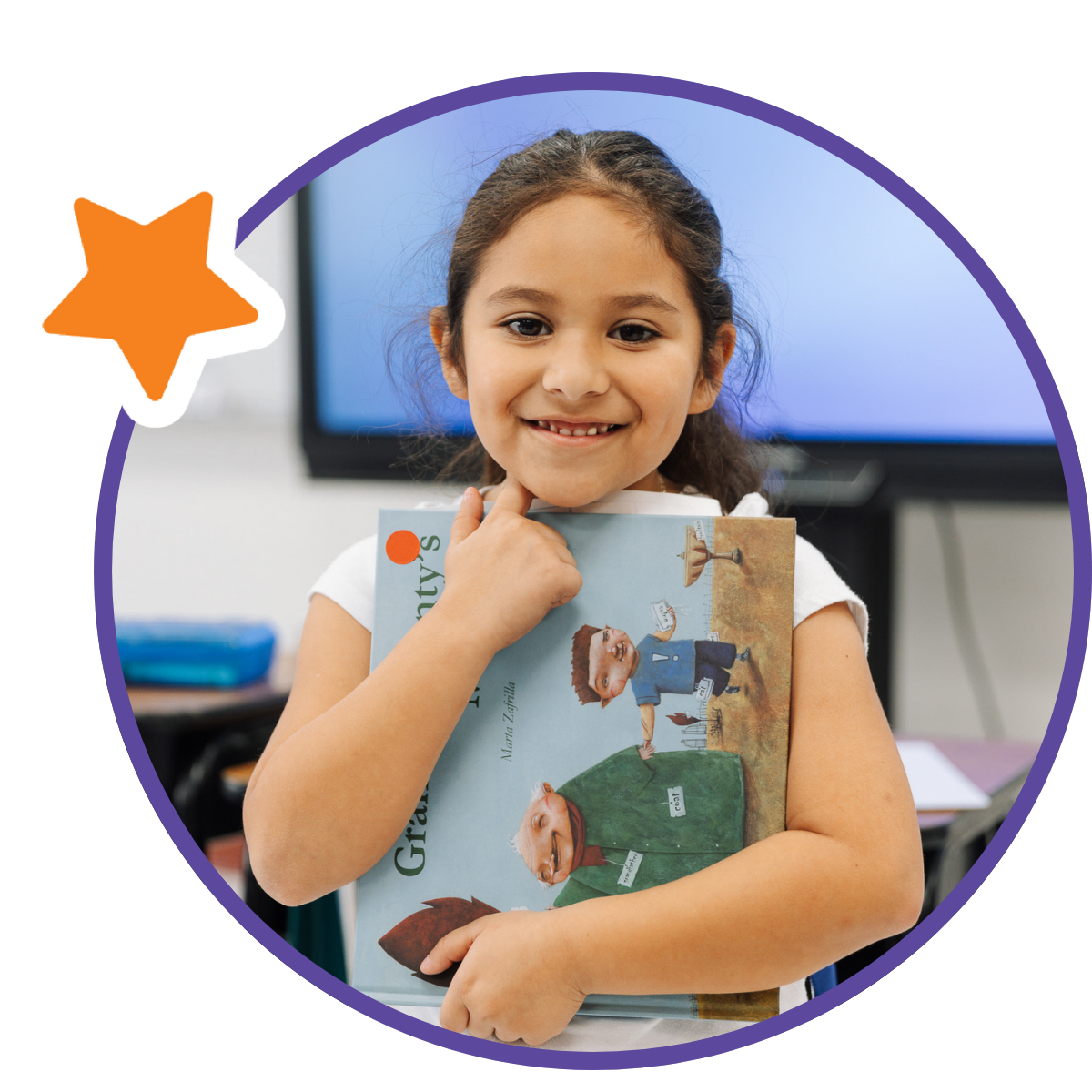 student smiling with book